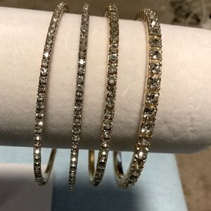 Set of 4 cubic Zirconia Bangle Bracelets (3  gold tone, one silver tone)